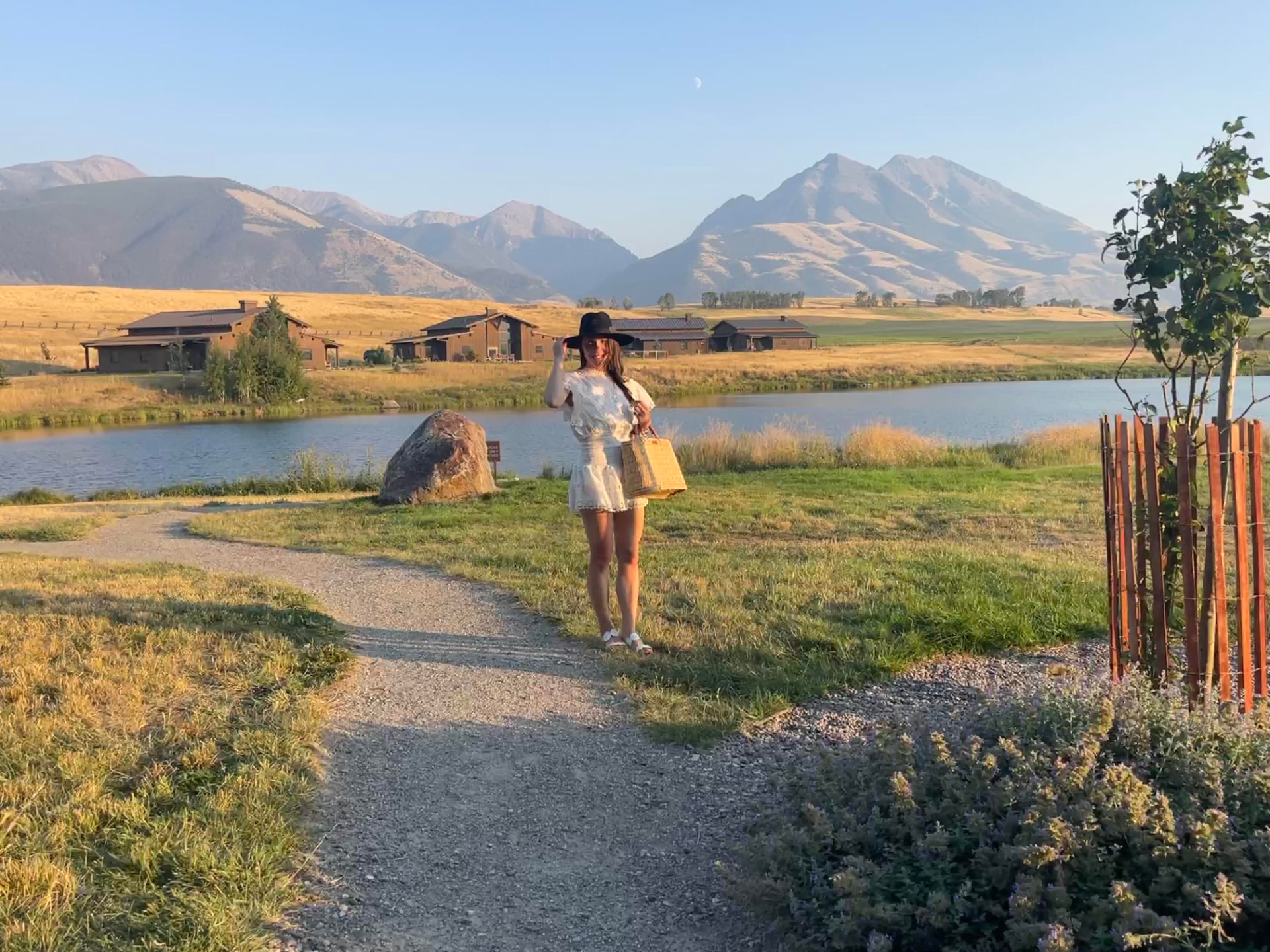Lindsay Burke in a wide-brimmed hat on a valley path